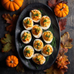 Pumpkin Deviled Eggs styled as Halloween party appetizers