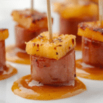 Overhead Pineapple Kielbasa Appetizers arranged in neat rows.​