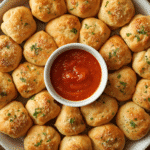 Pull‑apart meatball stuffed biscuits with cheese stretch.