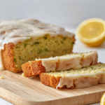 Close-up lemon zucchini bread slice showing tender crumb and thin lemon glaze