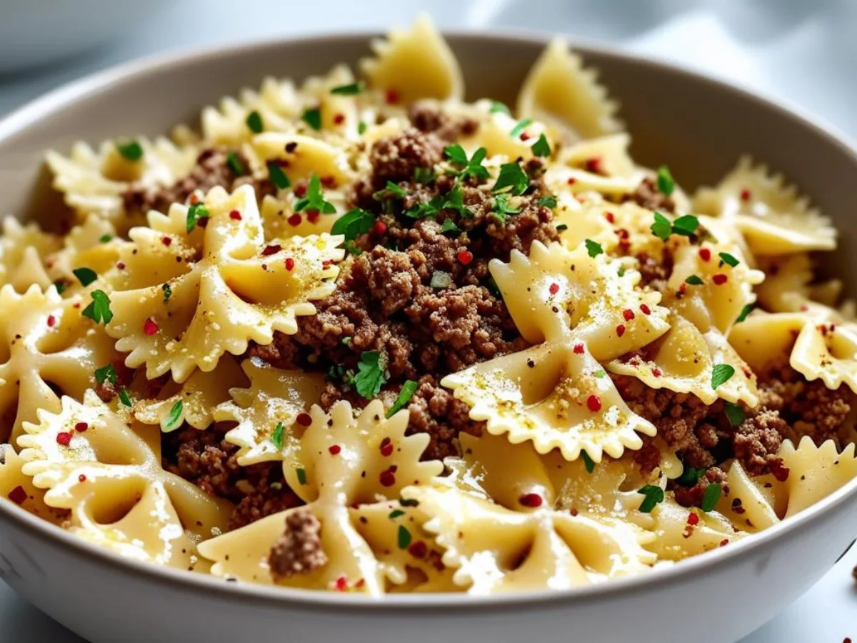 Garlic butter beef bowtie pasta in a skillet
