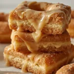 A tray of Brown Butter Maple Donut Bars sliced into rectangles.